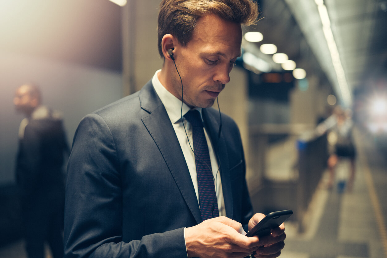 hotel executive listening to hospitality podcasts on his way into the office